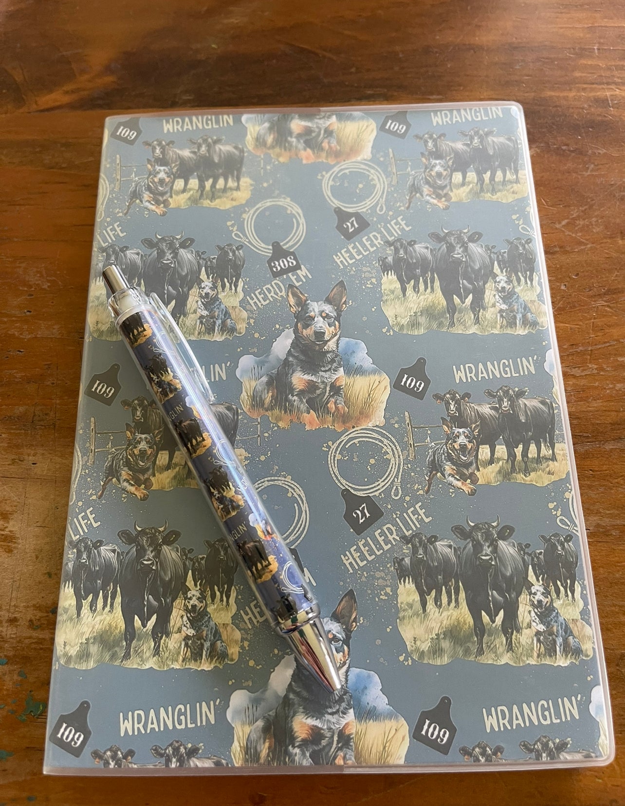 Notebook - Angus cows and heelers