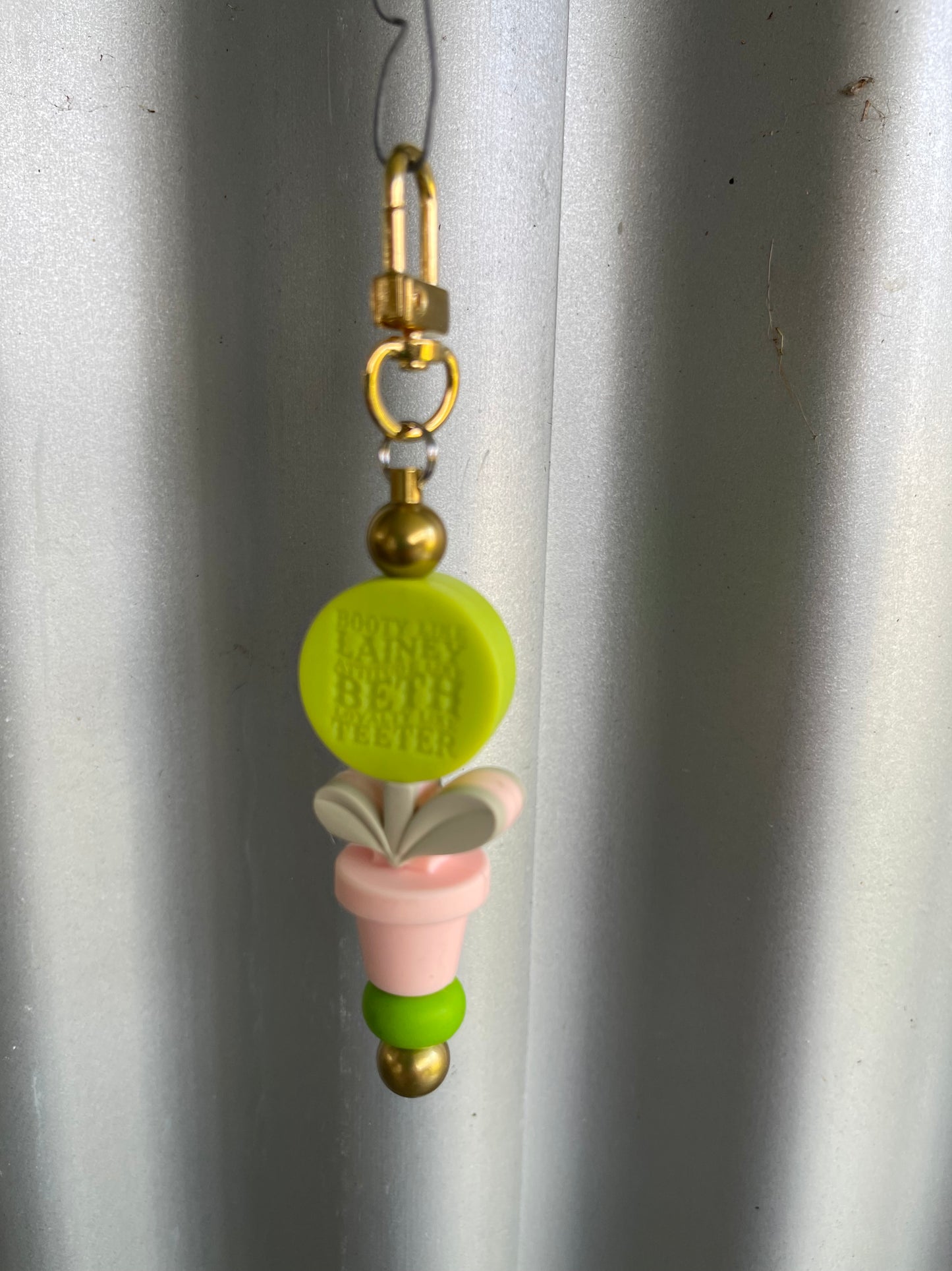 Keyring, beaded -booty like laney. Attitude like Beth. Loyalty like teeter flower pot.