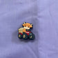 Croc Charm - Highland cow - on tractor