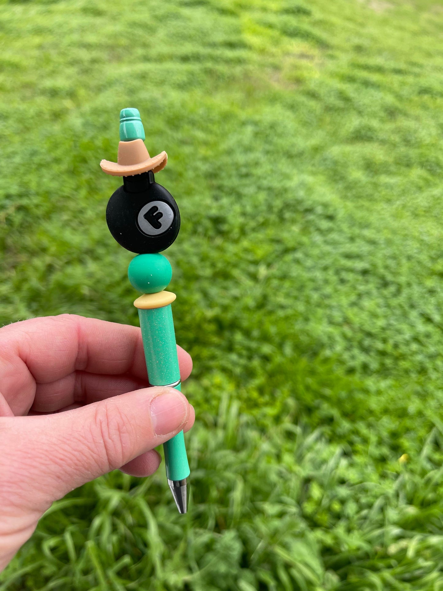 The F bomb teal beaded pen